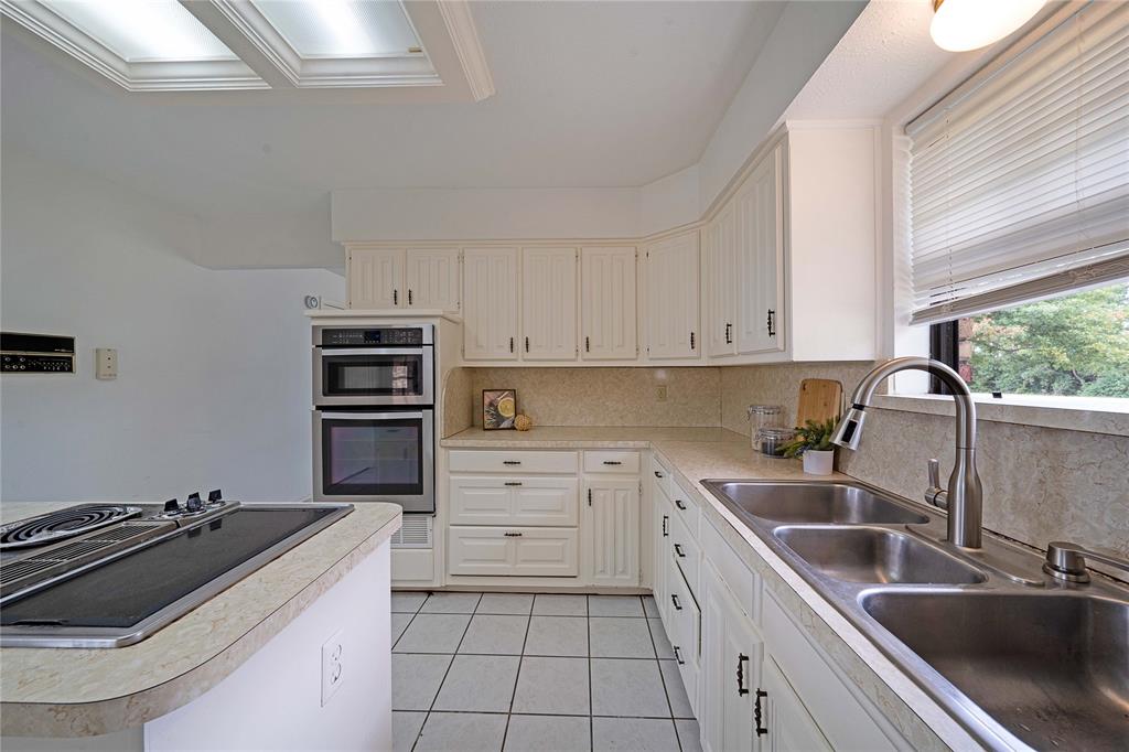 241 High Rdg Drive New Hope, TX 75071 - Photo 13 of 20 a kitchen that has a sink and a stove