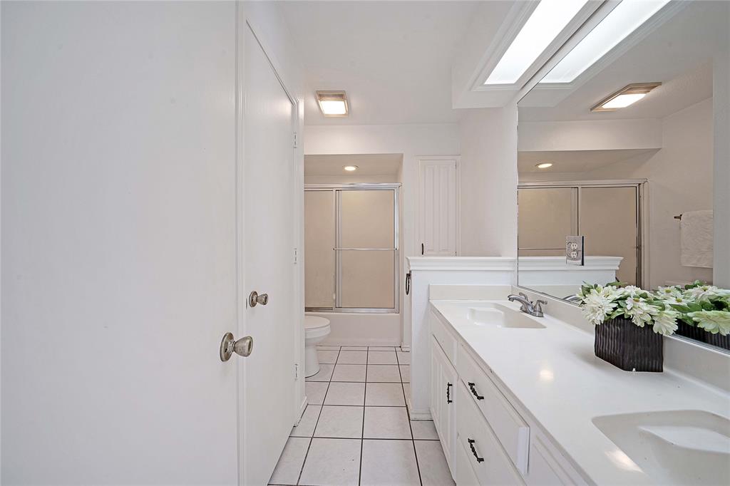 241 High Rdg Drive New Hope, TX 75071 - Photo 15 of 20 a spacious bathroom with a double vanity sink a mirror and a bathtub