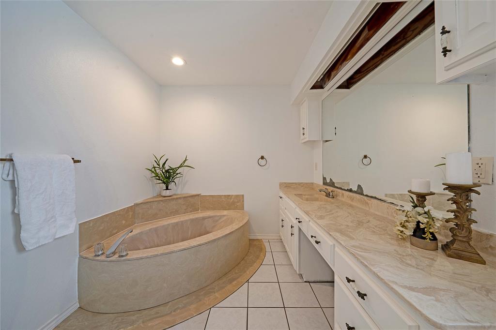 241 High Rdg Drive New Hope, TX 75071 - Photo 17 of 20 a bathroom with a granite countertop sink a toilet and bathtub