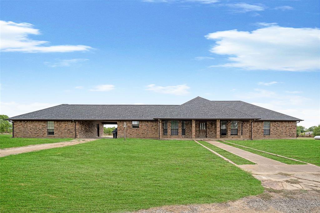 241 High Rdg Drive New Hope, TX 75071 - Photo 2 of 20 a front view of a house with garden