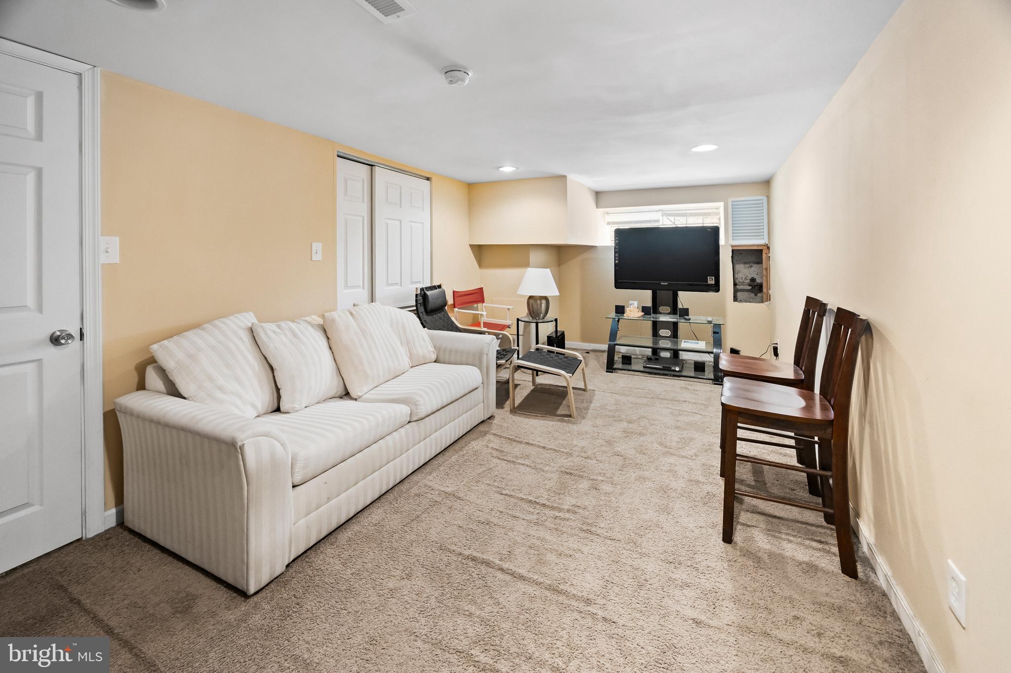 1837 73rd Avenue Philadelphia, PA 19126 - Photo 16 of 19 a living room with furniture and a flat screen tv