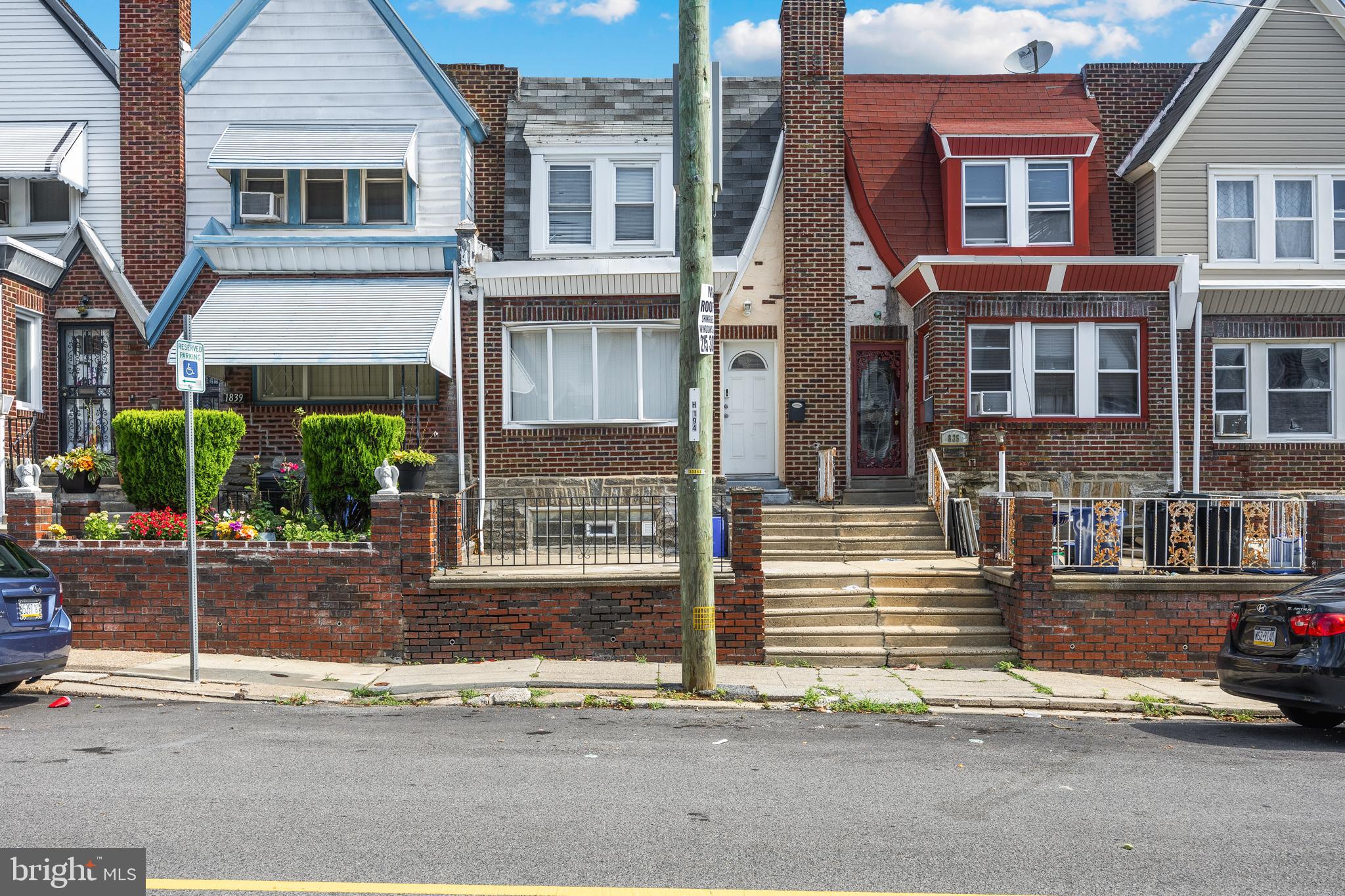 1837 73rd Avenue Philadelphia, PA 19126 - Photo 2 of 19 a view of a brick house with many windows and plants