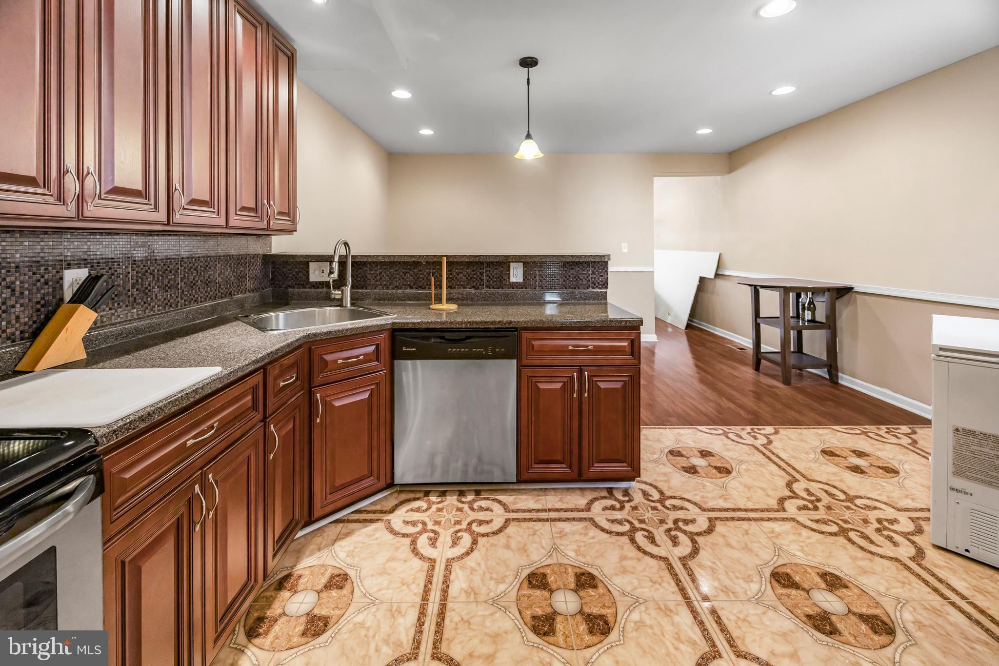 1837 73rd Avenue Philadelphia, PA 19126 - Photo 10 of 19 a kitchen with a sink and cabinets