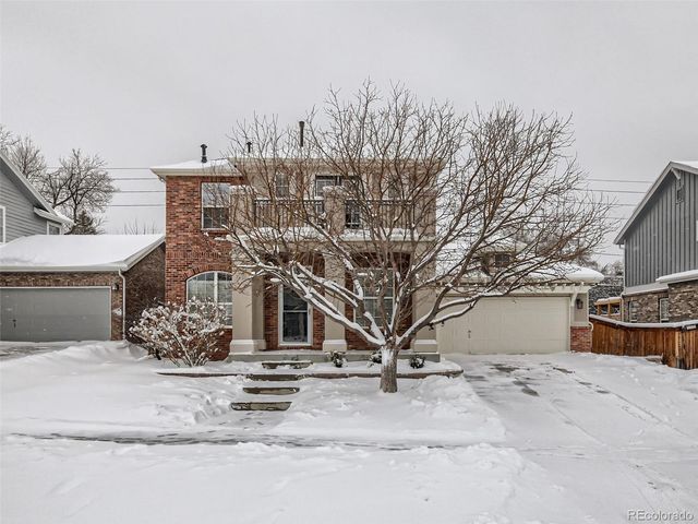 a view of a house with large trees