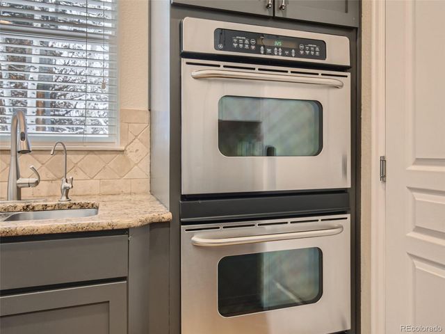 a view of washer and dryer with a sink