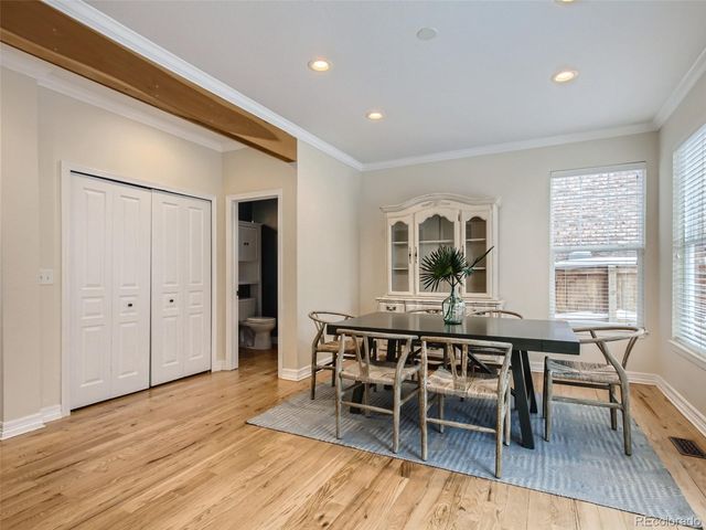a view of a dining room with furniture window and wooden floor