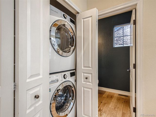 a view of a hallway with washer and dryer