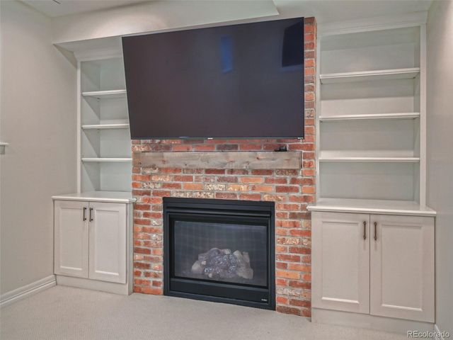 a living room with a fireplace