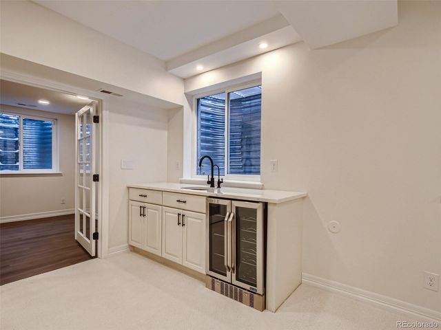 a view of a kitchen counter space and windows