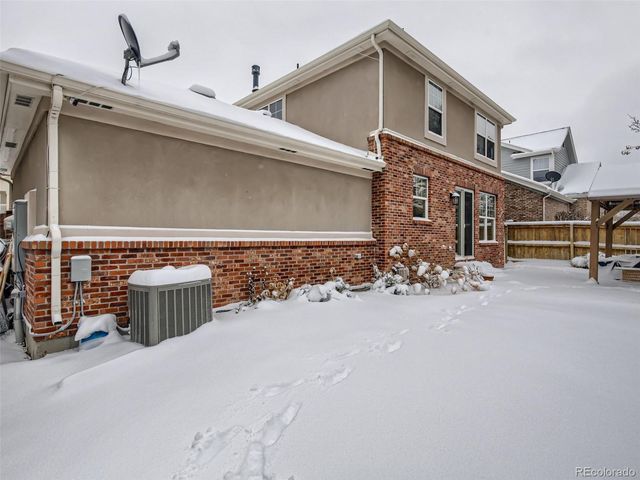a view of a house with wooden walls