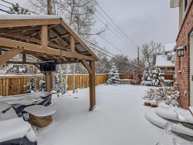 a view of a patio with couches and pool