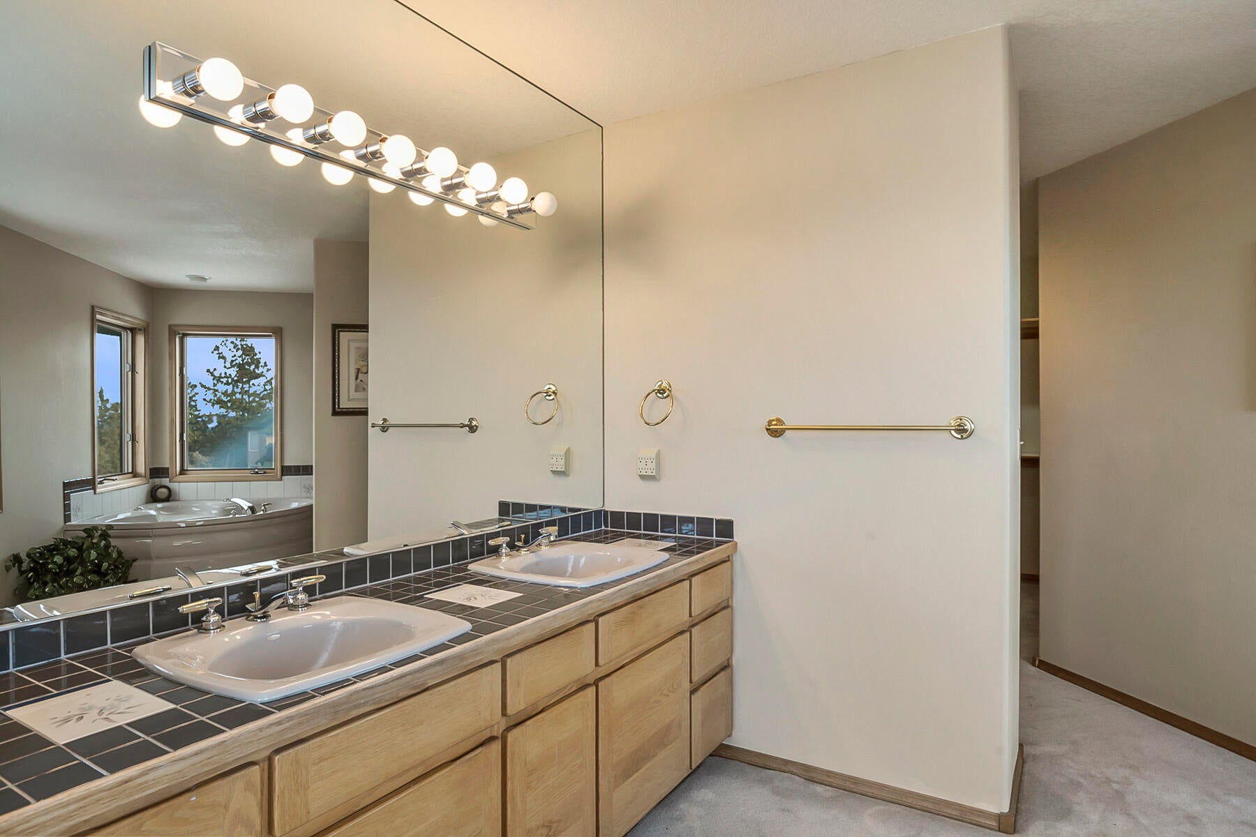 3808 Northwest Summerfield Road Bend, OR 97703 - Photo 32 of 38 Dual vanity with wall to wall mirror.