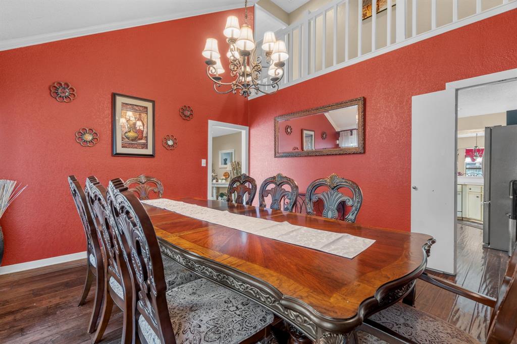 5107 Racquet Club Drive Arlington, TX 76017 - Photo 12 of 40 a view of a dining room with furniture and chandelier