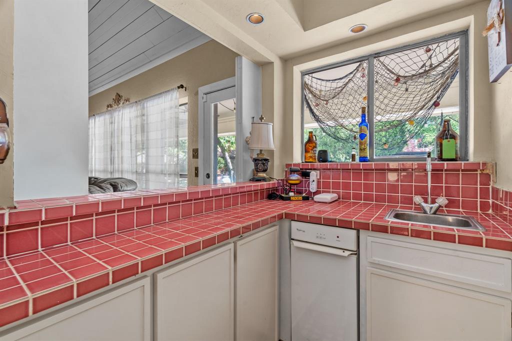 5107 Racquet Club Drive Arlington, TX 76017 - Photo 17 of 40 a room with sink and large windows