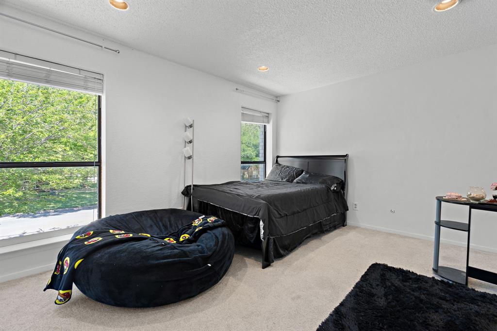 5107 Racquet Club Drive Arlington, TX 76017 - Photo 20 of 40 a bedroom with a bed and window