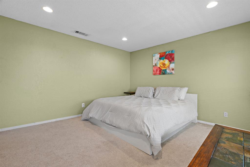 5107 Racquet Club Drive Arlington, TX 76017 - Photo 25 of 40 a bed room with a bed
