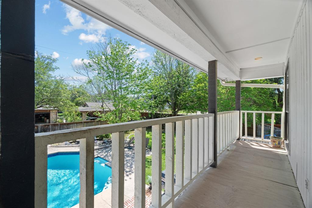 5107 Racquet Club Drive Arlington, TX 76017 - Photo 27 of 40 a view of a balcony with wooden floor