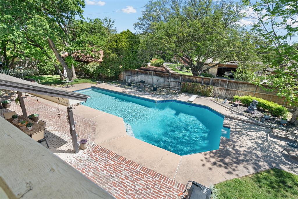 5107 Racquet Club Drive Arlington, TX 76017 - Photo 28 of 40 a view of a swimming pool with a patio and backyard