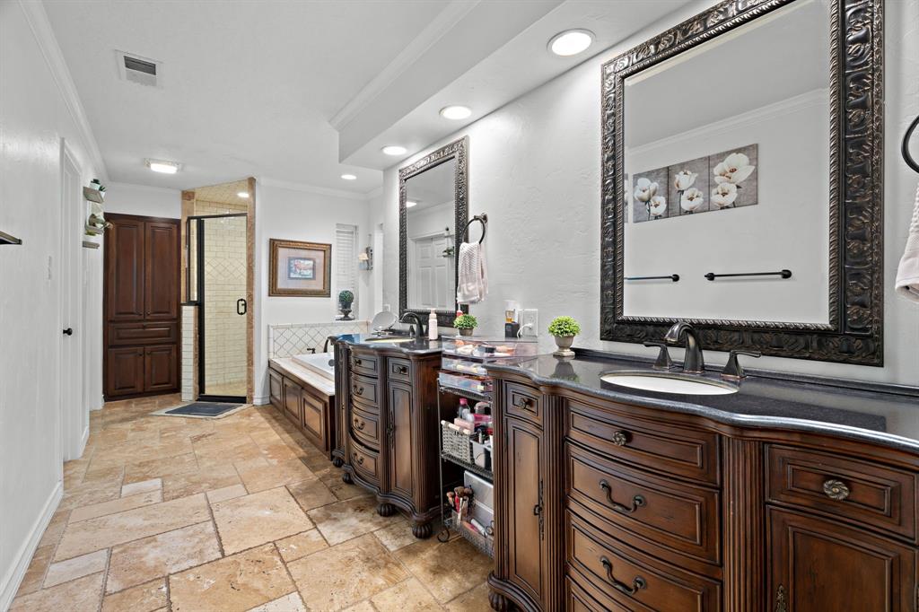 5107 Racquet Club Drive Arlington, TX 76017 - Photo 30 of 40 a bathroom with a sink double vanity and a mirror