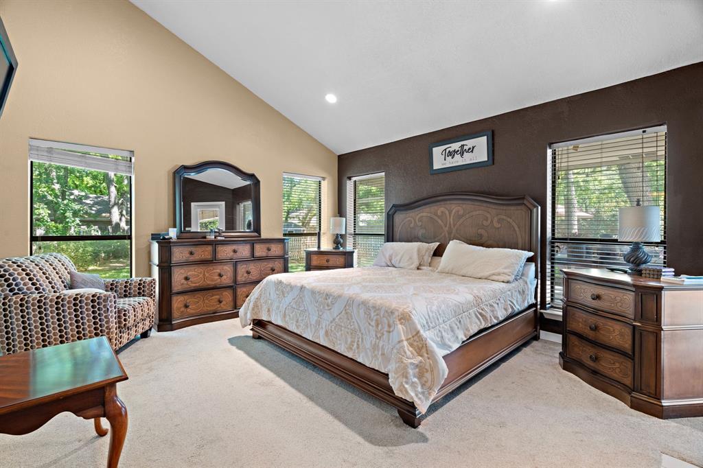 5107 Racquet Club Drive Arlington, TX 76017 - Photo 34 of 40 a bedroom with a bed window and dresser