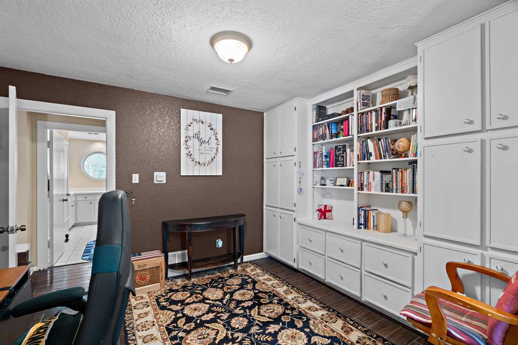 5107 Racquet Club Drive Arlington, TX 76017 - Photo 35 of 40 a room with toys and a book shelf