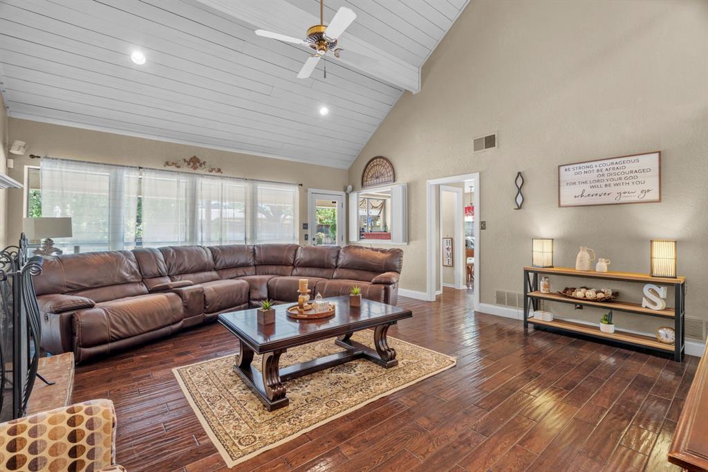 5107 Racquet Club Drive Arlington, TX 76017 - Photo 8 of 40 a living room with furniture a wooden floor and window