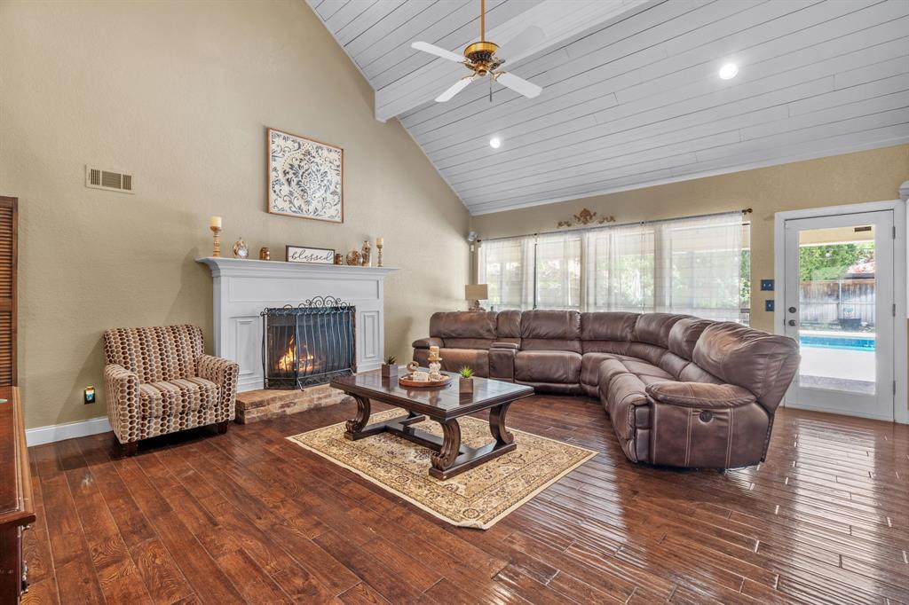 5107 Racquet Club Drive Arlington, TX 76017 - Photo 9 of 40 a living room with furniture and a fireplace