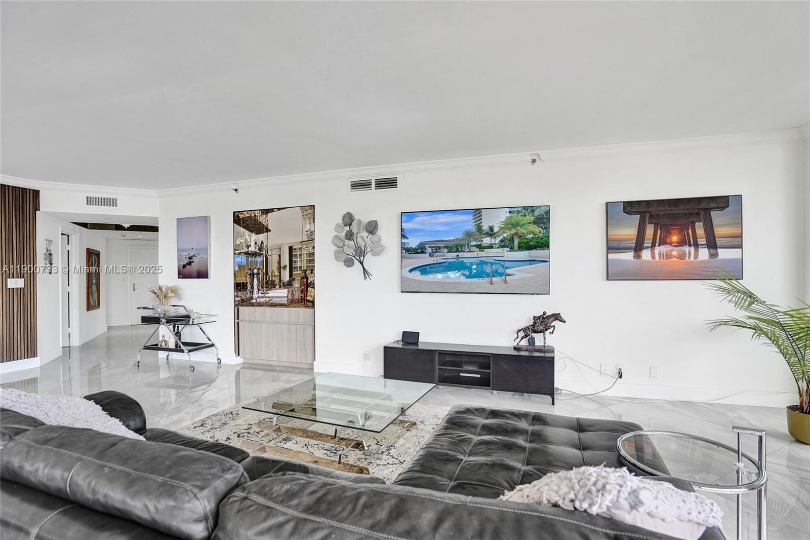 3000 Island Boulevard, Unit 1106 Aventura, FL 33160 - Photo 13 of 71 a living room with furniture and wooden floor