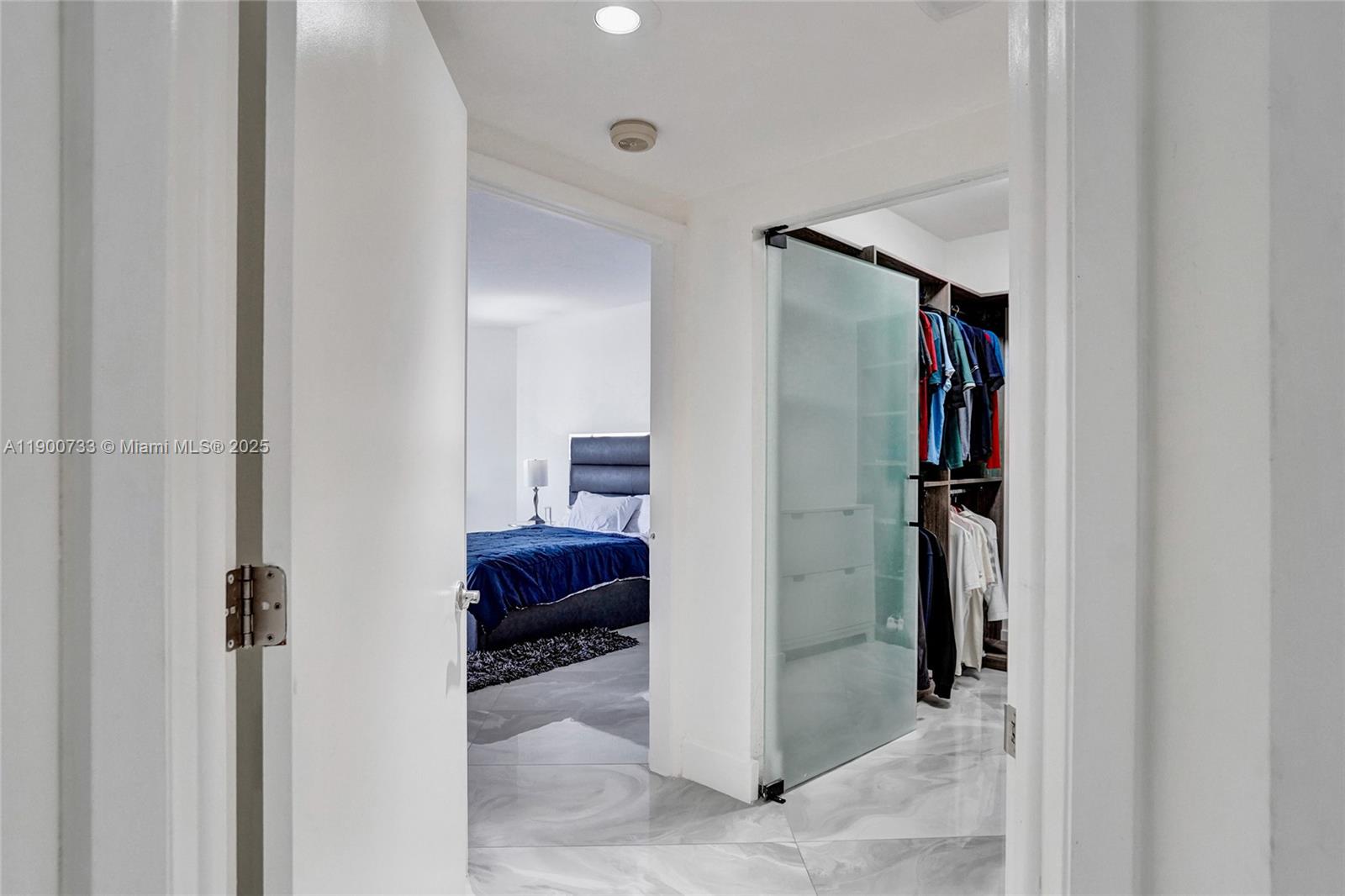 3000 Island Boulevard, Unit 1106 Aventura, FL 33160 - Photo 47 of 71 a view of walk in closet with clothes