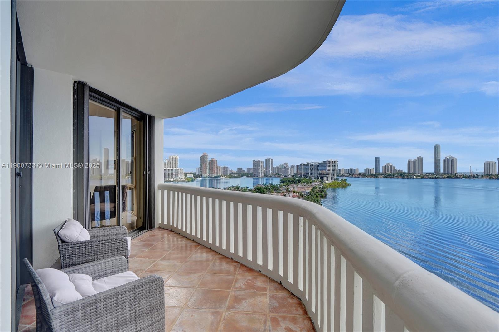 3000 Island Boulevard, Unit 1106 Aventura, FL 33160 - Photo 55 of 71 a view of a balcony with furniture