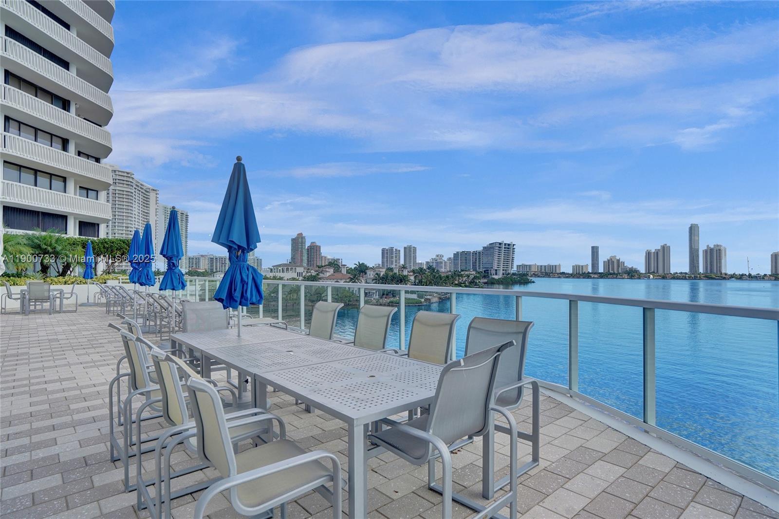 3000 Island Boulevard, Unit 1106 Aventura, FL 33160 - Photo 65 of 71 a view of a terrace with furniture and stove
