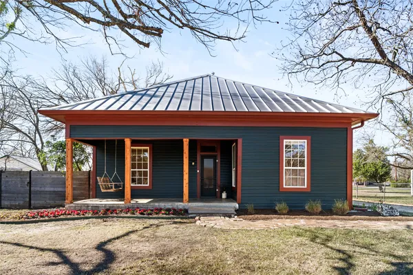 front view of a house with a yard