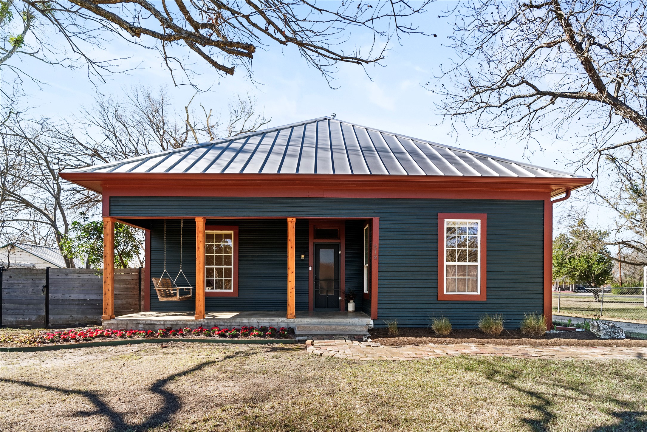 front view of a house with a yard