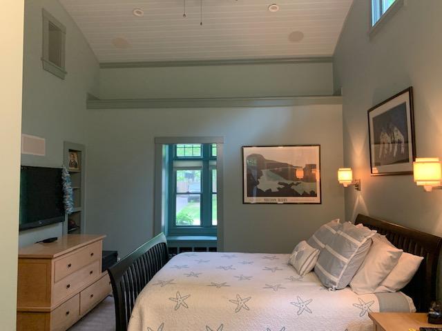 58 Pram Road Hyannis, MA 02601 - Photo 6 of 9 a bedroom with a bed and flat tv screen on the dresser