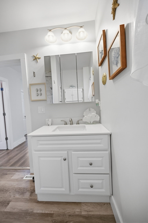 70 Wyman Street Lynn, MA 01905 - Photo 19 of 41 a bathroom with a sink mirror and vanity