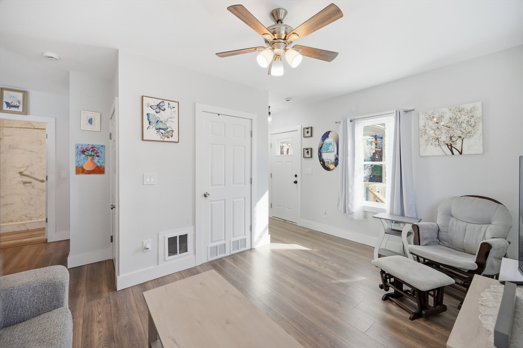 70 Wyman Street Lynn, MA 01905 - Photo 2 of 41 a view of a livingroom with furniture and a ceiling fan