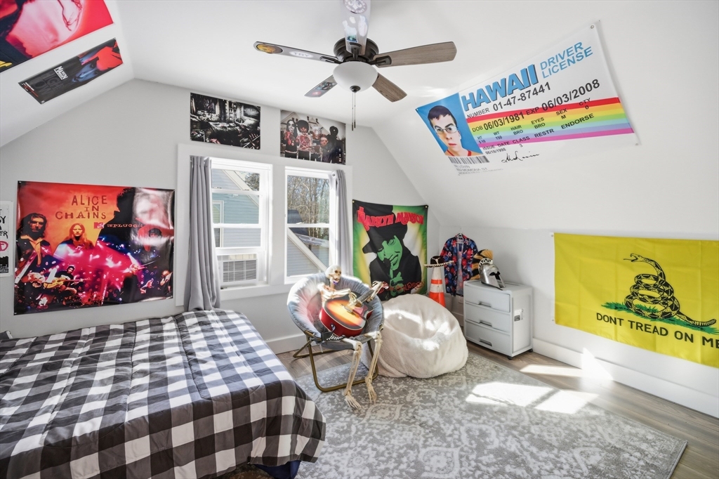 70 Wyman Street Lynn, MA 01905 - Photo 23 of 41 a bedroom with furniture and a bed