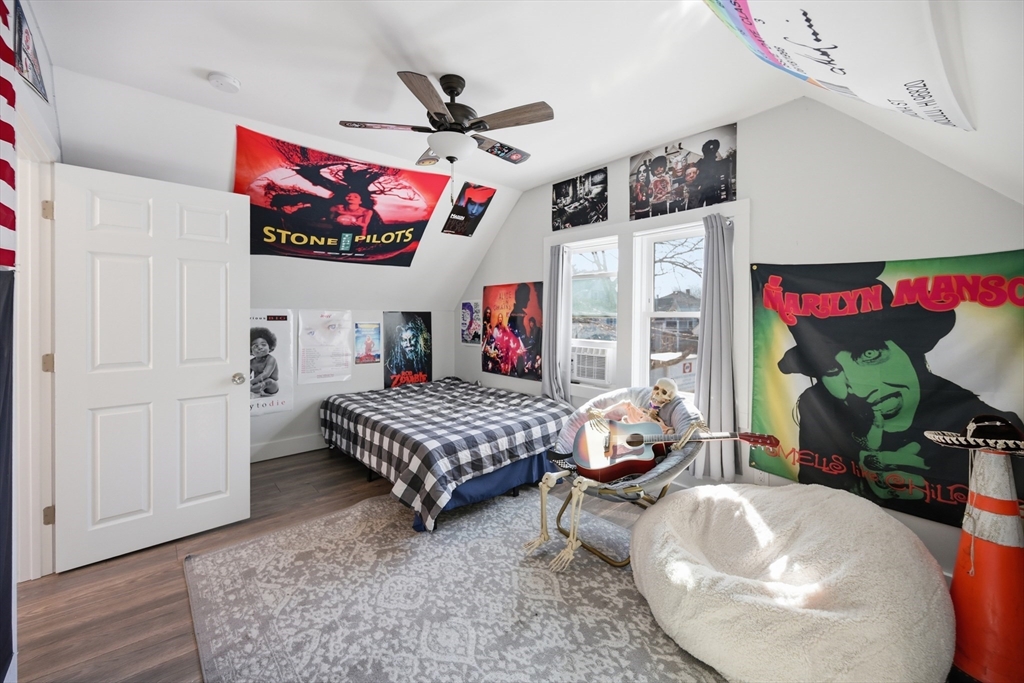 70 Wyman Street Lynn, MA 01905 - Photo 24 of 41 a living room with furniture and a flat screen tv