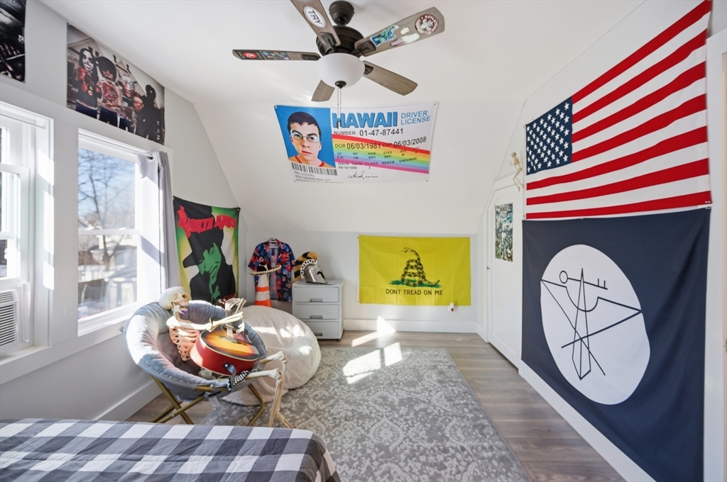 70 Wyman Street Lynn, MA 01905 - Photo 26 of 41 a living room with furniture and a fireplace