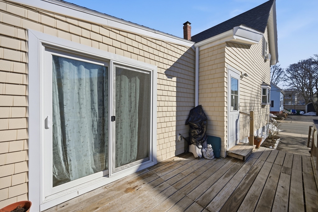 70 Wyman Street Lynn, MA 01905 - Photo 35 of 41 a view of a house with wooden deck