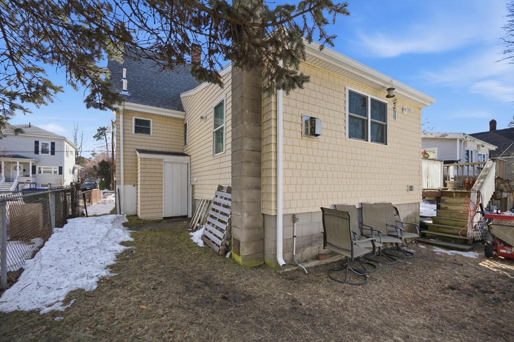 70 Wyman Street Lynn, MA 01905 - Photo 39 of 41 a backyard of a house with barbeque oven and outdoor seating