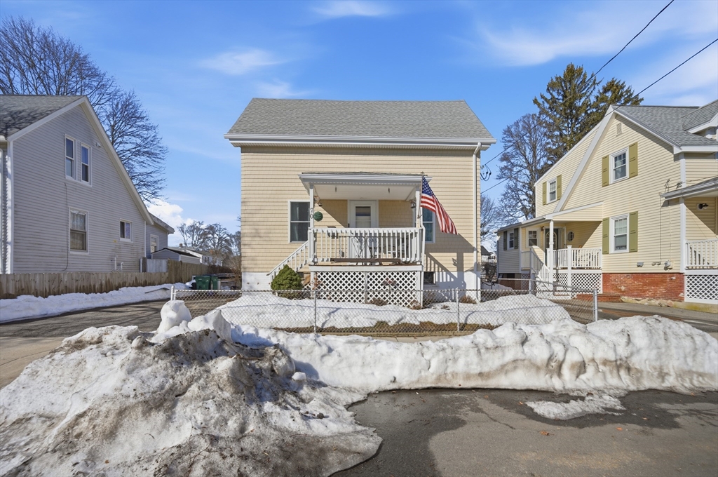 70 Wyman Street Lynn, MA 01905 - Photo 40 of 41 a front view of a house with a yard