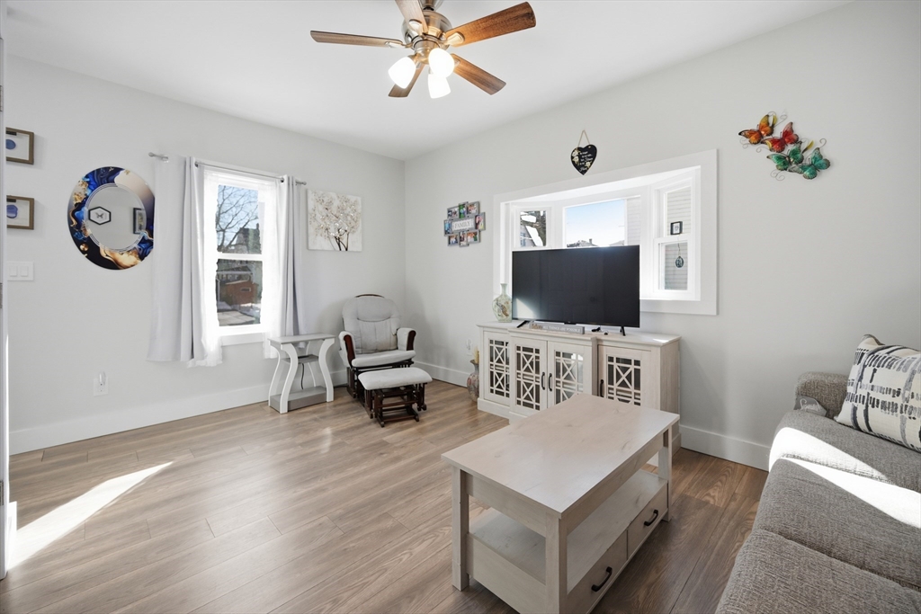 70 Wyman Street Lynn, MA 01905 - Photo 4 of 41 a living room with furniture and a flat screen tv