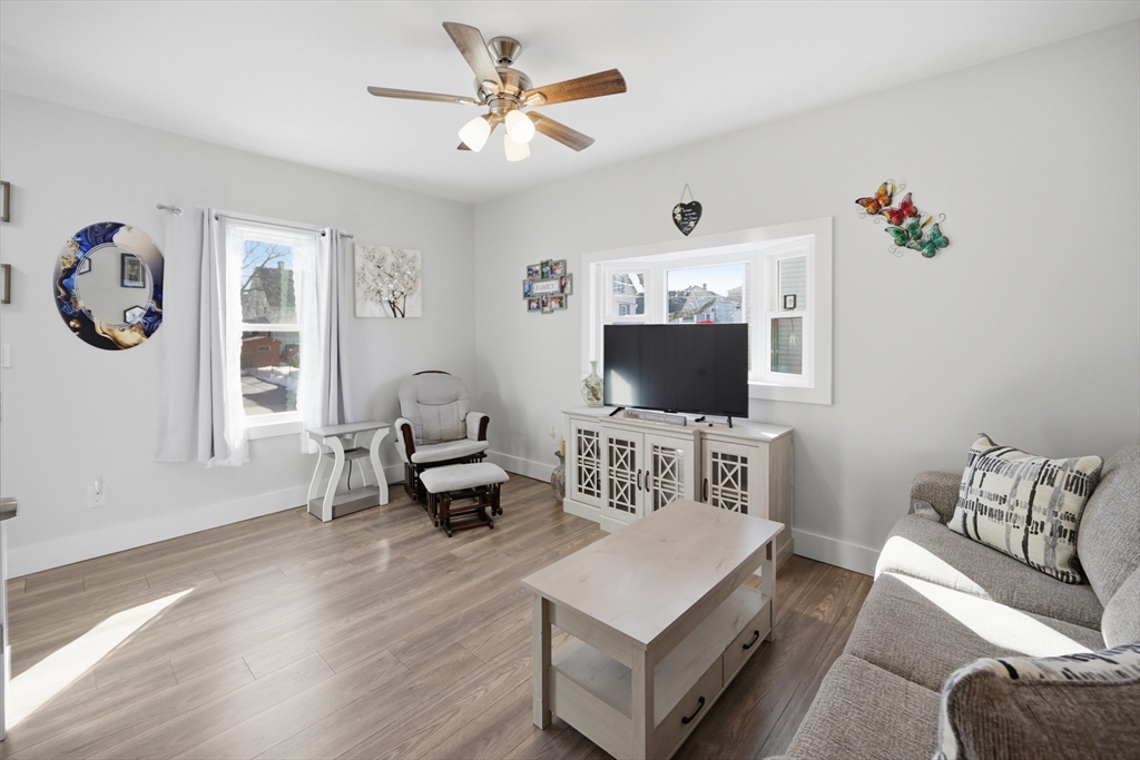 70 Wyman Street Lynn, MA 01905 - Photo 5 of 41 a living room with furniture and a flat screen tv