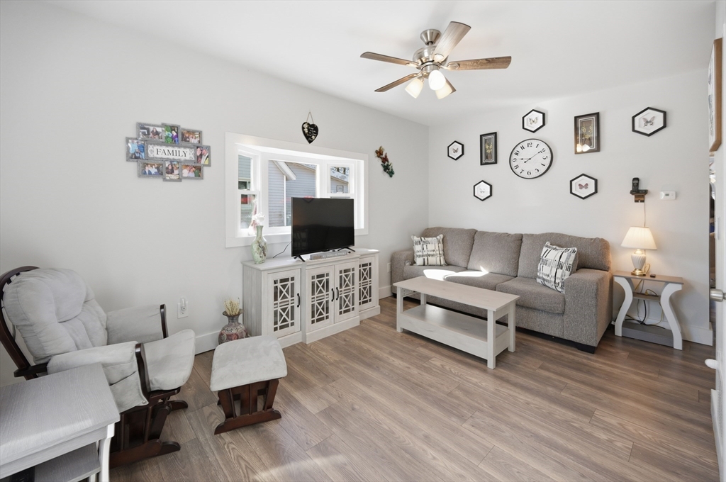 70 Wyman Street Lynn, MA 01905 - Photo 6 of 41 a living room with furniture and a flat screen tv
