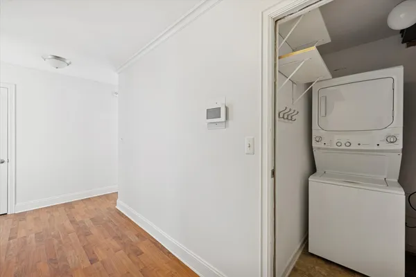 a view of storage and utility room with washer and dryer