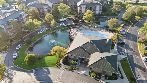 an aerial view of a house with outdoor space