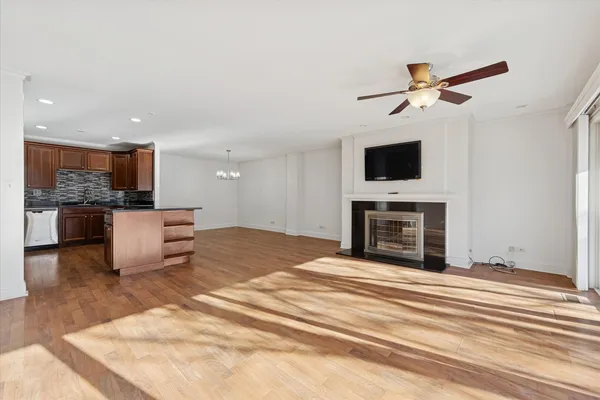 a view of a livingroom with furniture and a fireplace