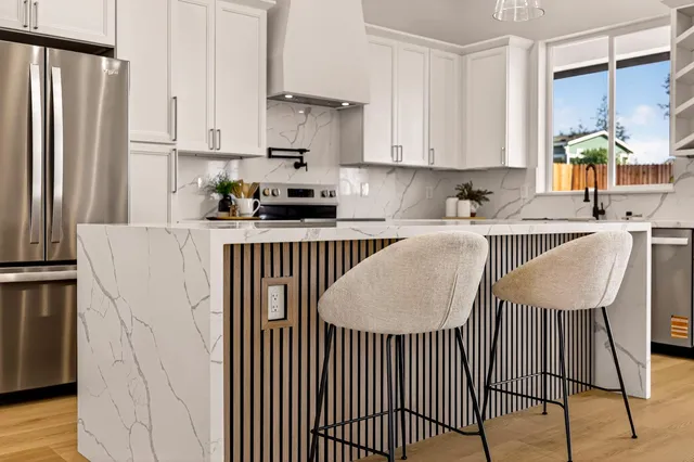 a kitchen with a sink stove and cabinets