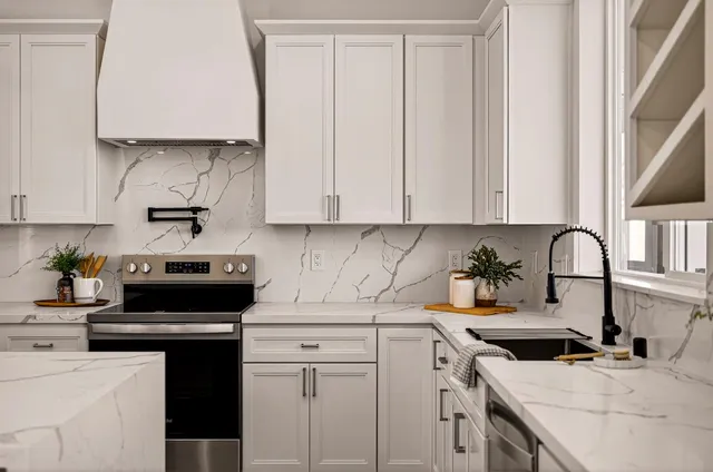 a kitchen with kitchen island a sink counter top space stainless steel appliances and a center island